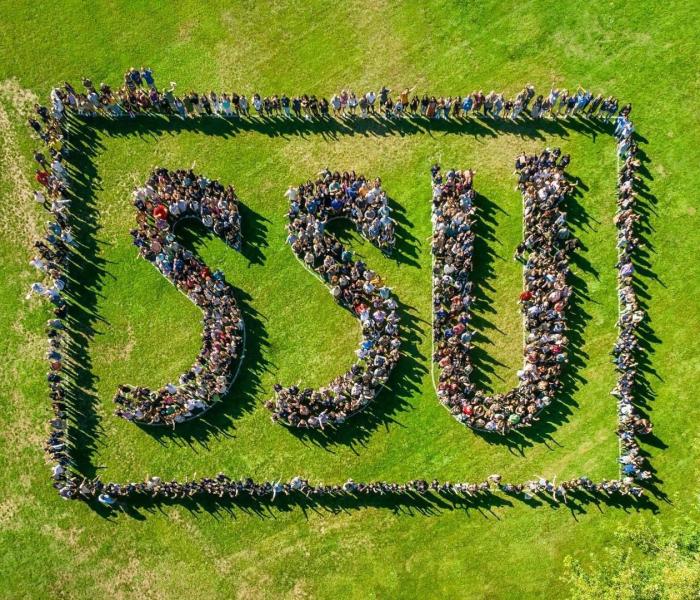 Aerial shot of students, faculty and staff spelling out "SSU"