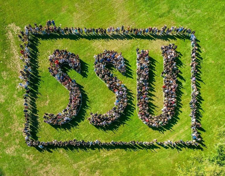 Aerial shot of students, faculty and staff spelling out "SSU"