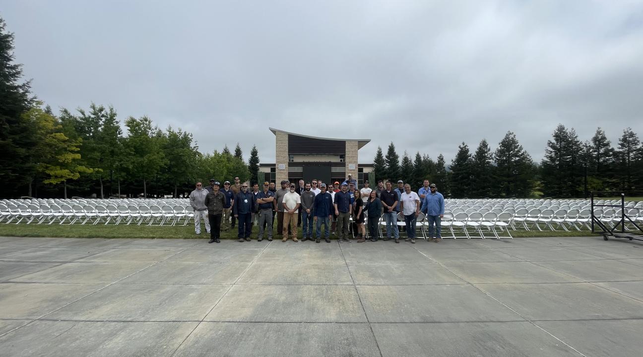 FM staff standing in front of chairs at GMC