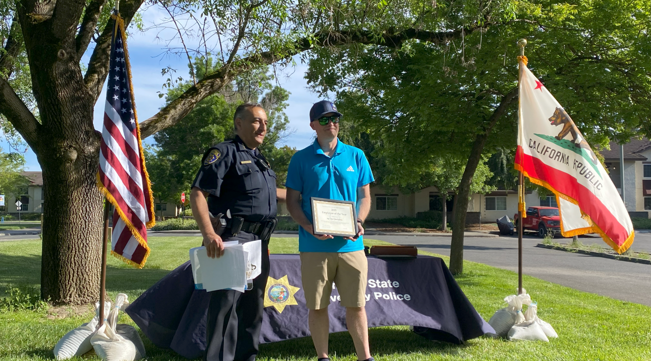 Chief Oweis recognixing Sgt. Mortenson as UPD Employee of the Year