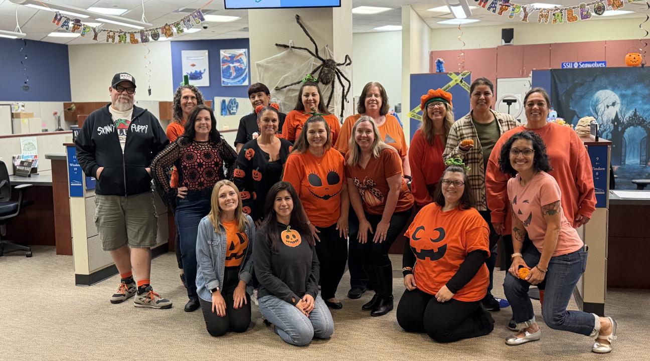 Team dressed as pumpkins