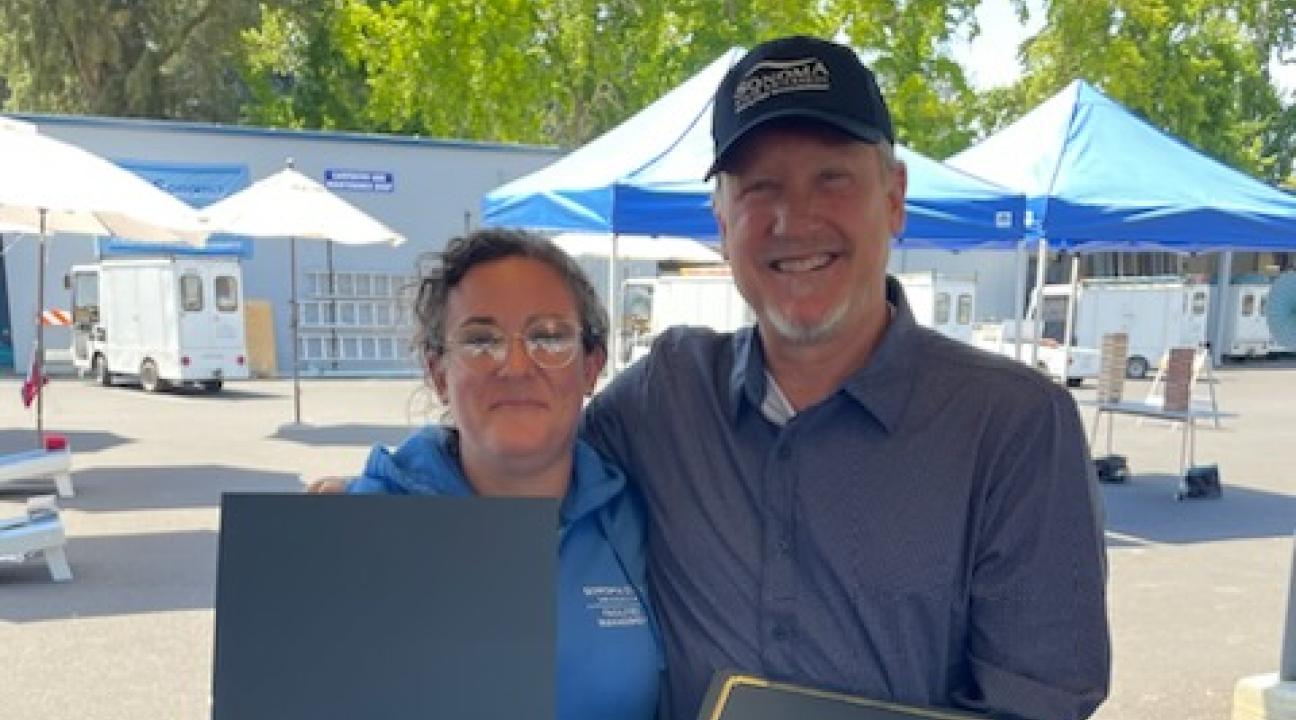 Tara Bogart  and Dana Twedell showing Tara's certificate