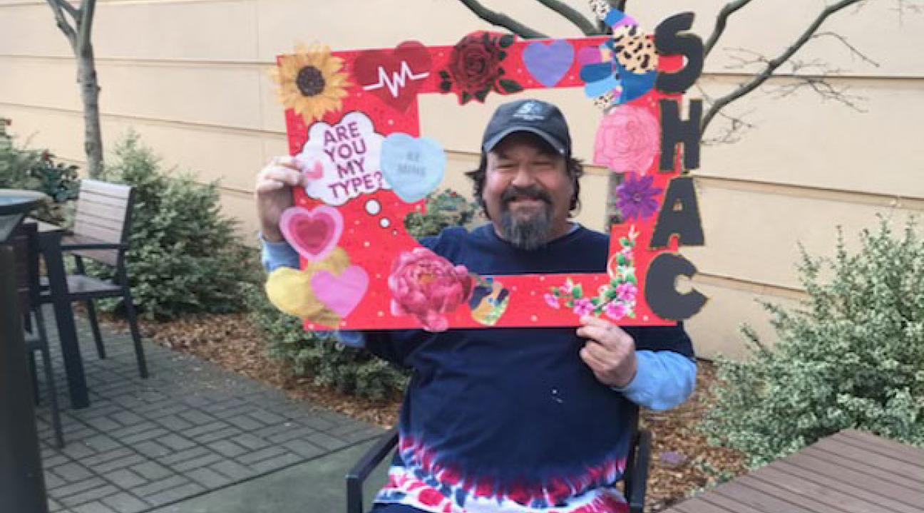 photo of person holding a frame around face