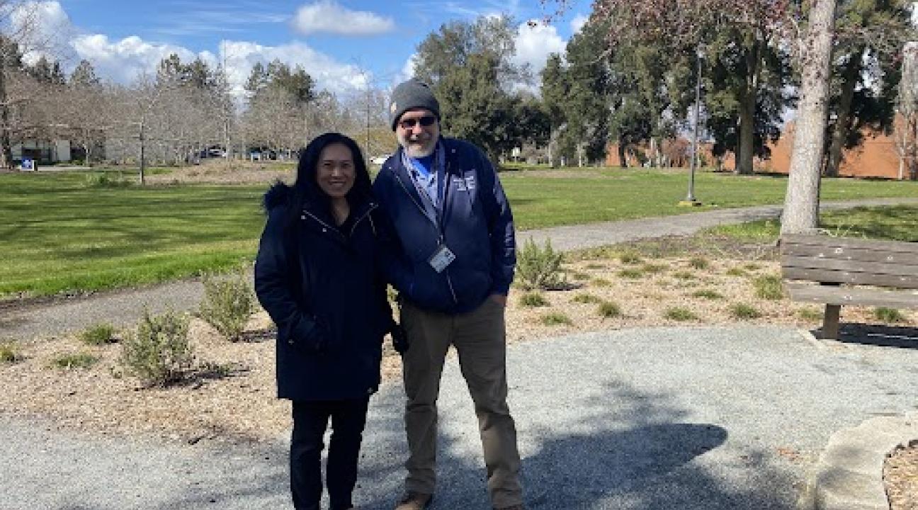 photo of two people standing next to each other