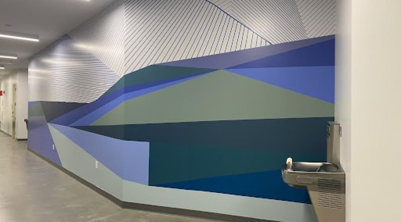 photo of wall painted in blues, greens and geometric patterns