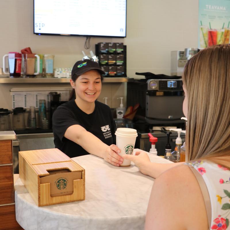 Picking up a coffee from Sip