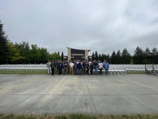 FM staff standing in front of chairs at GMC