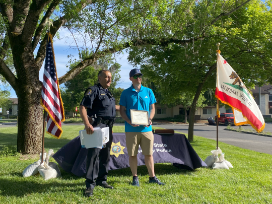 Chief Oweis recognixing Sgt. Mortenson as UPD Employee of the Year