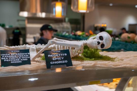 Skeleton laying atop the buffet line