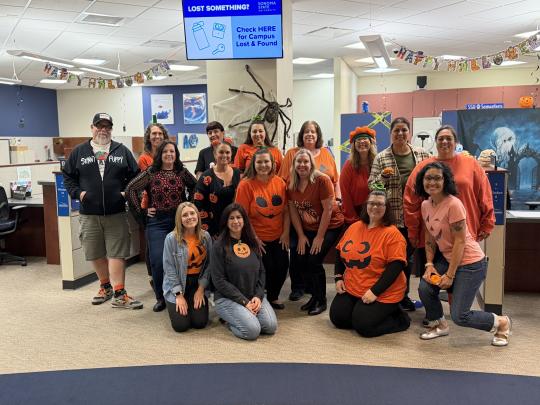 Team dressed as pumpkins