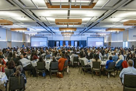 Conference attendees in ballroom