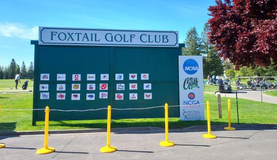 Board with Foxtail Golf Club at top and participating schools listed