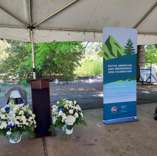 photo of banner, podium and flowers