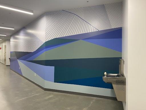 photo of wall painted in blues, greens and geometric patterns